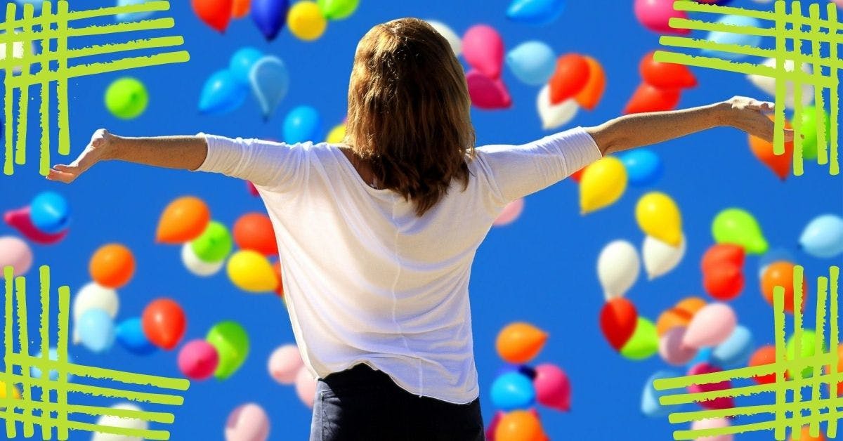 confident woman with balloons