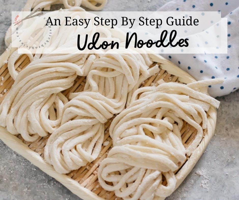 homemade udon noodles on a bamboo tray