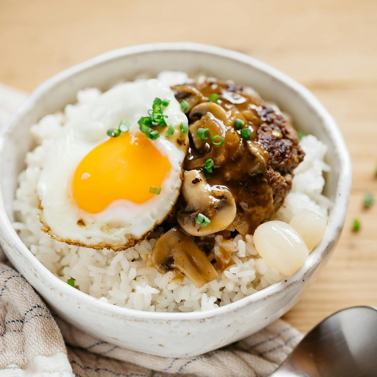 Loco moco served in a donburi bowl