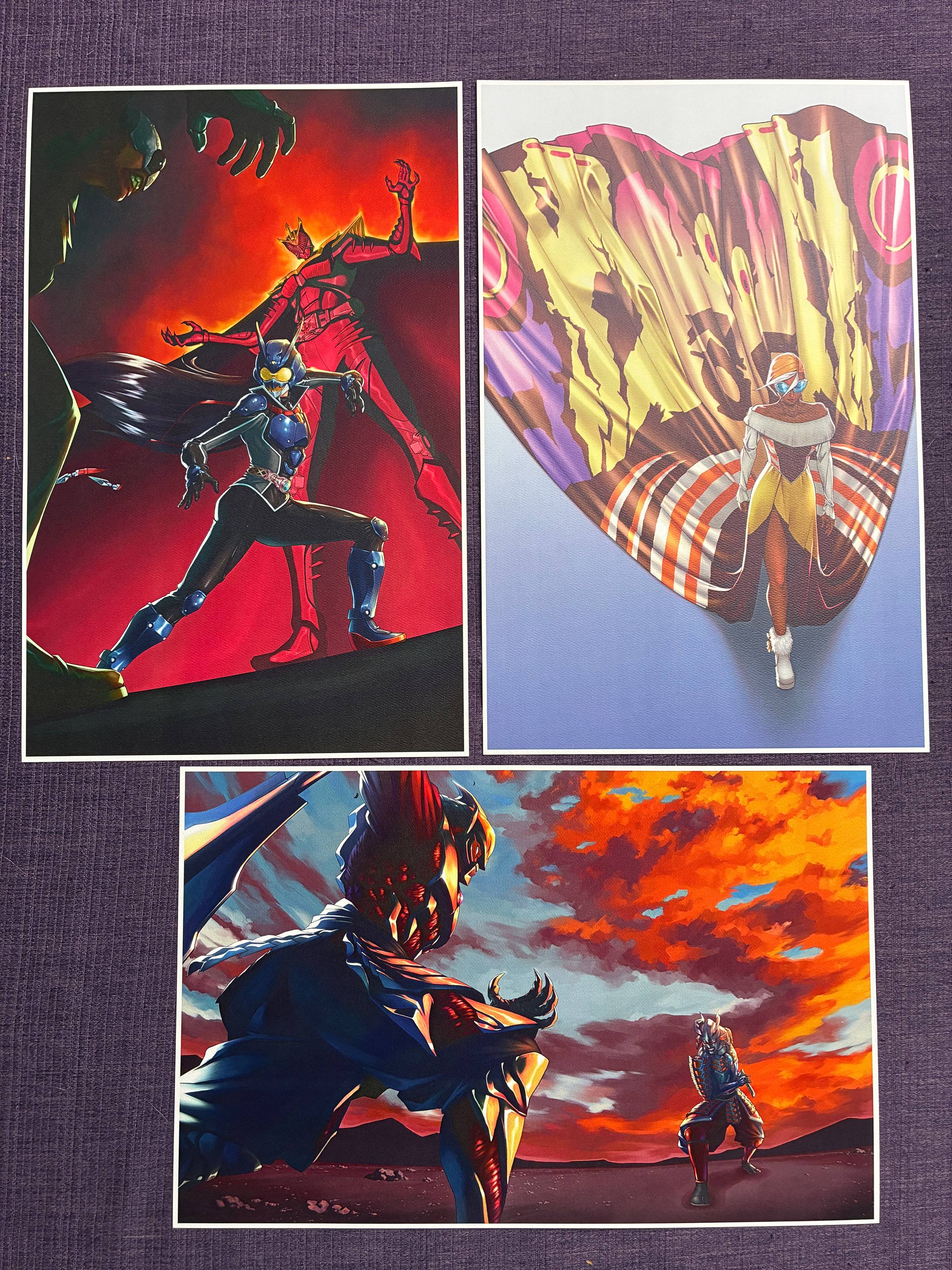 Three prints. Top left is Kamen Rider Eins facing off against a tropper. Behind her looms Kamen Rider Fatale. Top right is my interpretation of Mothra as a fashion model wearing a long dress that has Mothra's wing pattern. Bottm print is Ultraman Belial in samurai armor facing off against Ultraman Zero, also wearing samurai armor.