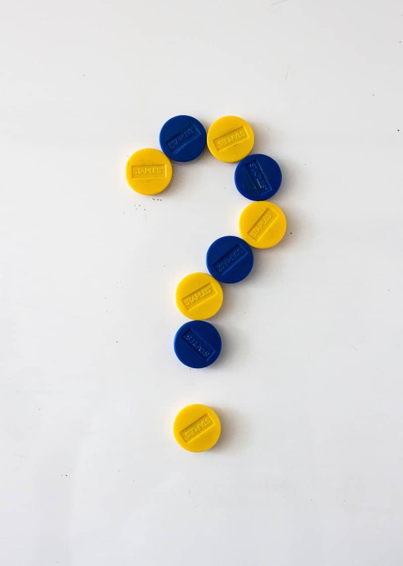 a group of colorful balls forming a question mark