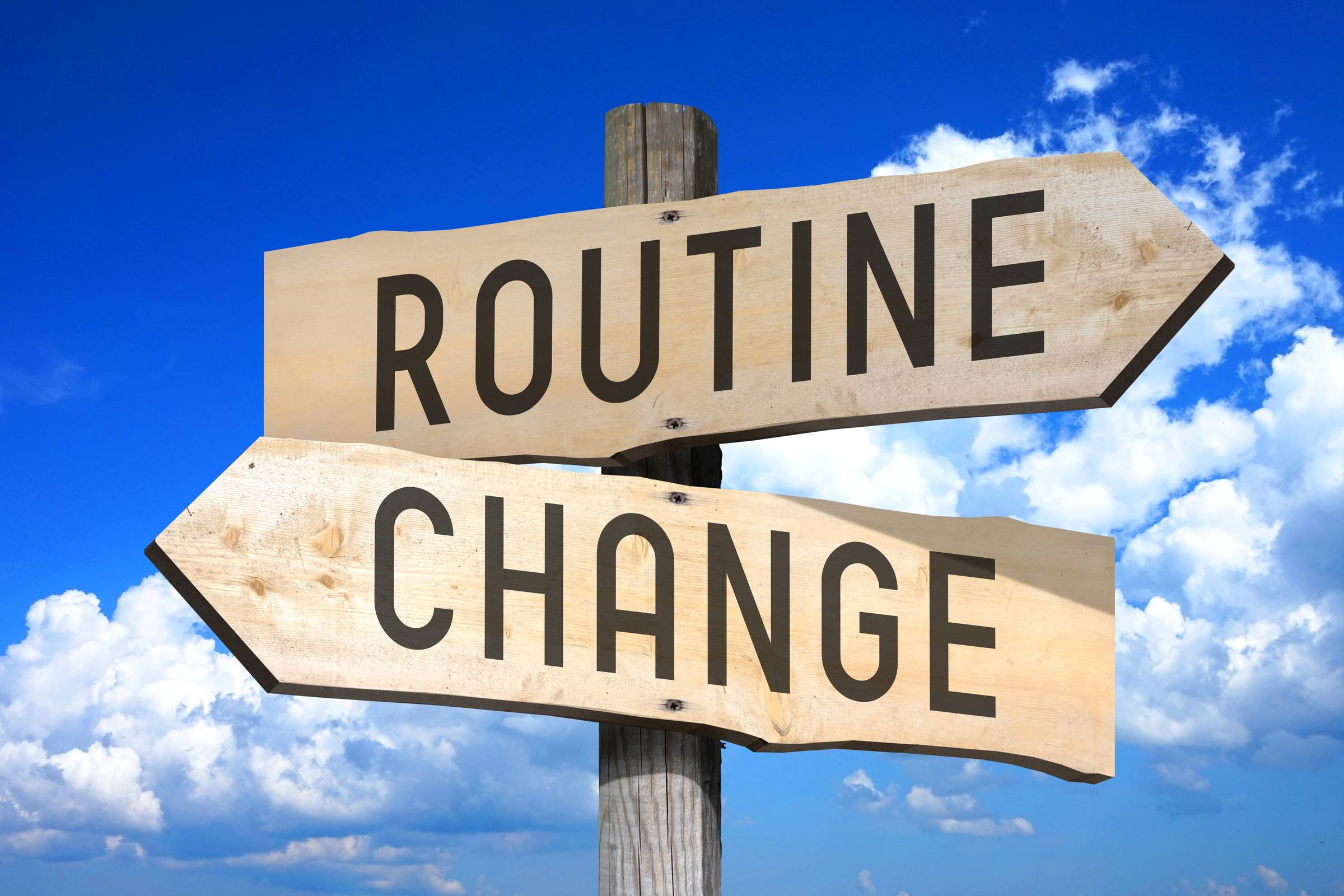 Routine, change - wooden signpost