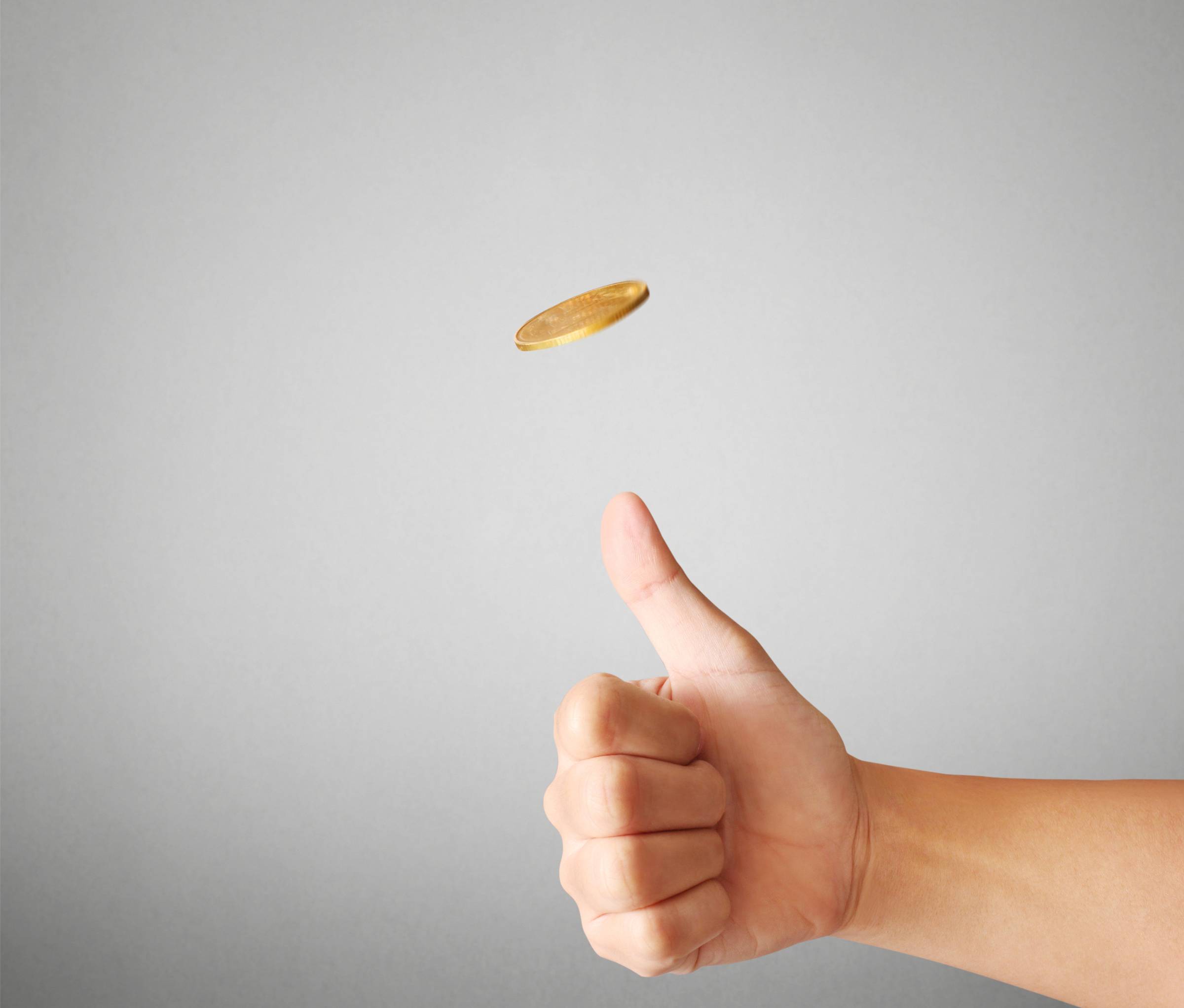 Thumb flipping a coin