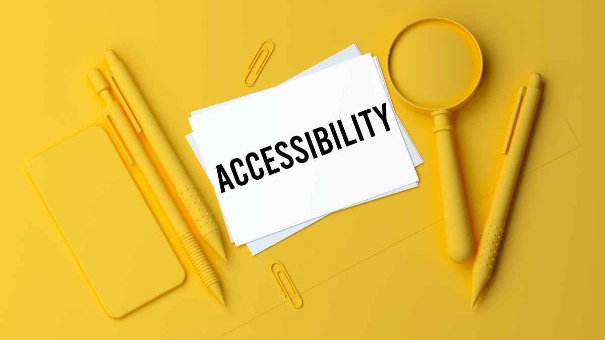 orange image with the word accessibility surrounded by tools like pens, pencils, magnifying glass, etc.