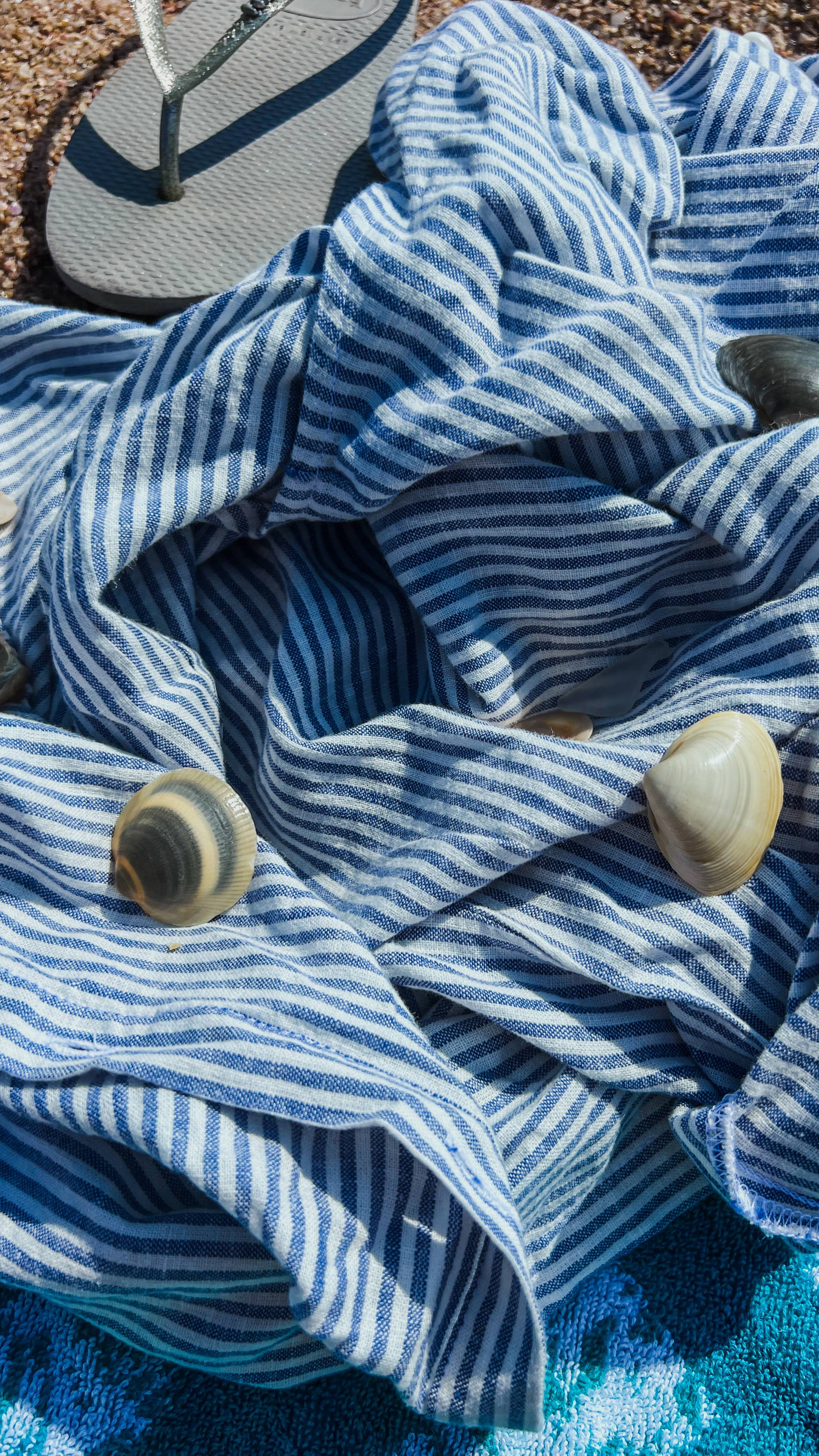 Image of shells on a t-shirt on the beach