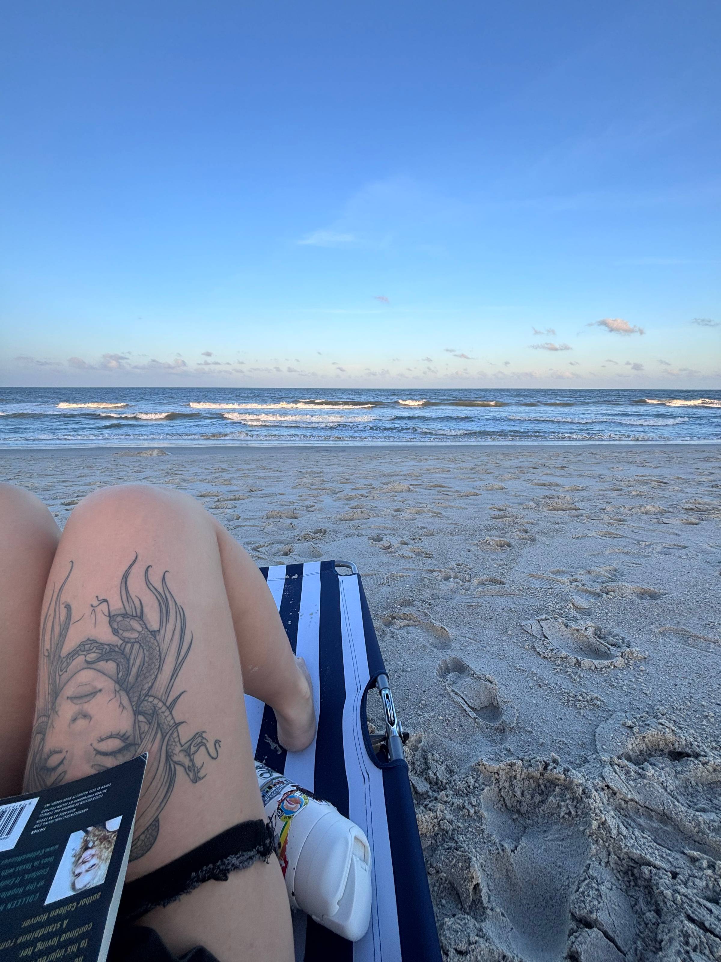 Image of me reading on the beach at blue hour