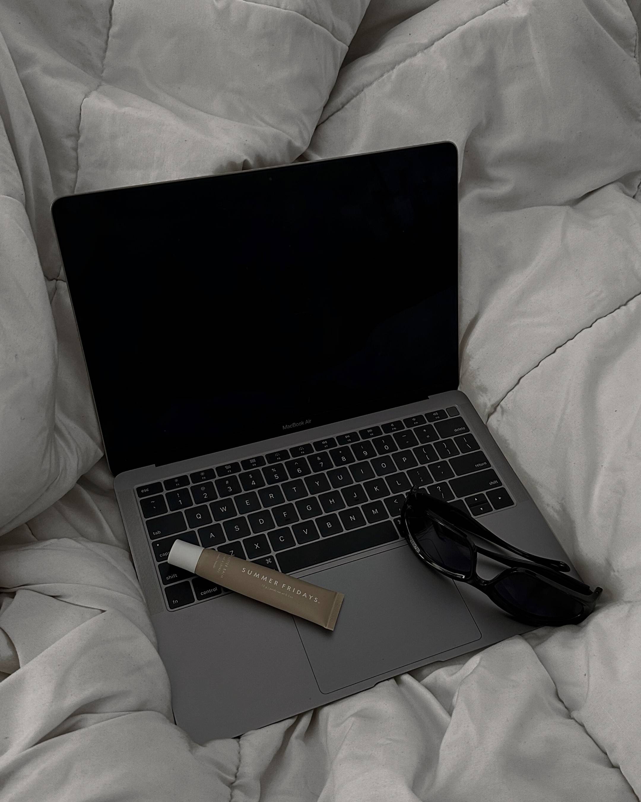 Laptop on a bed