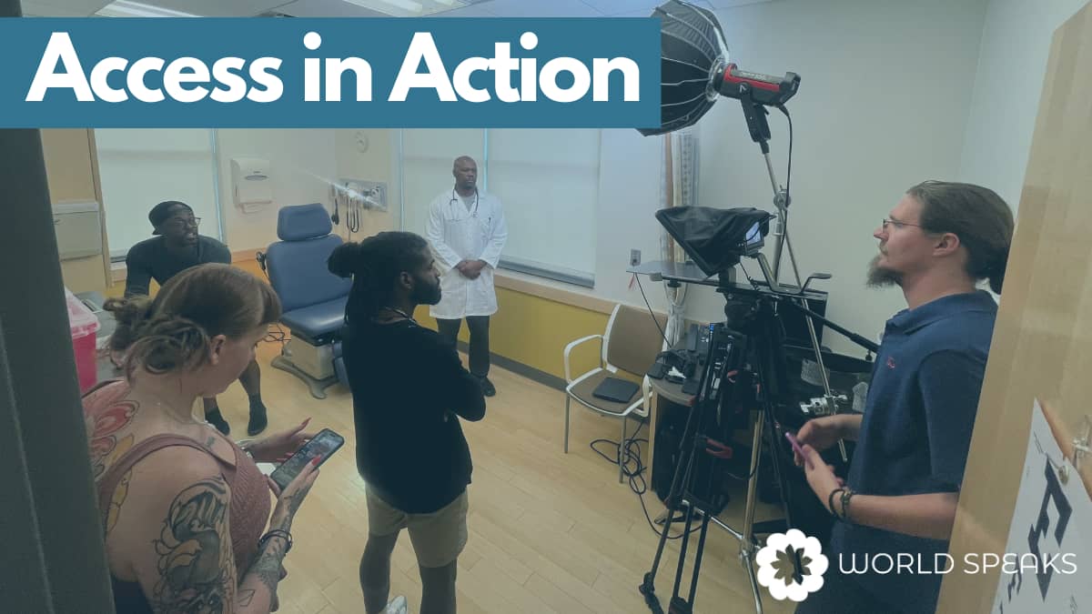 A film crew stands in a medical office. Above the photo are the words "Access in Action" and the World Speaks logo is in the lower right corner. 