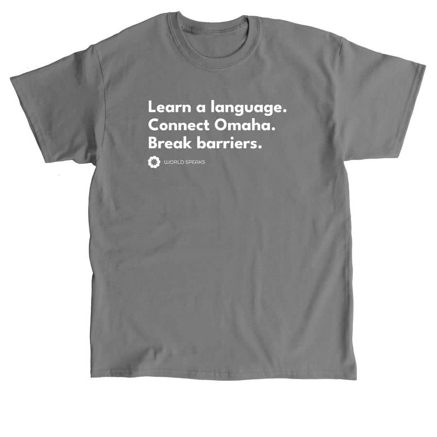 Image shows a grey t-shirt with the words "Learn a language. Connect Omaha. Break Barriers." 