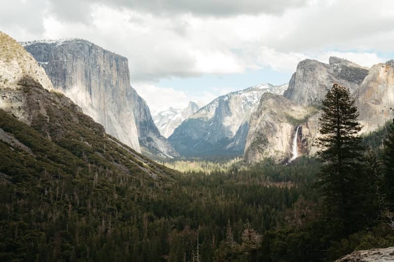 A view of a valley with mountains in the background