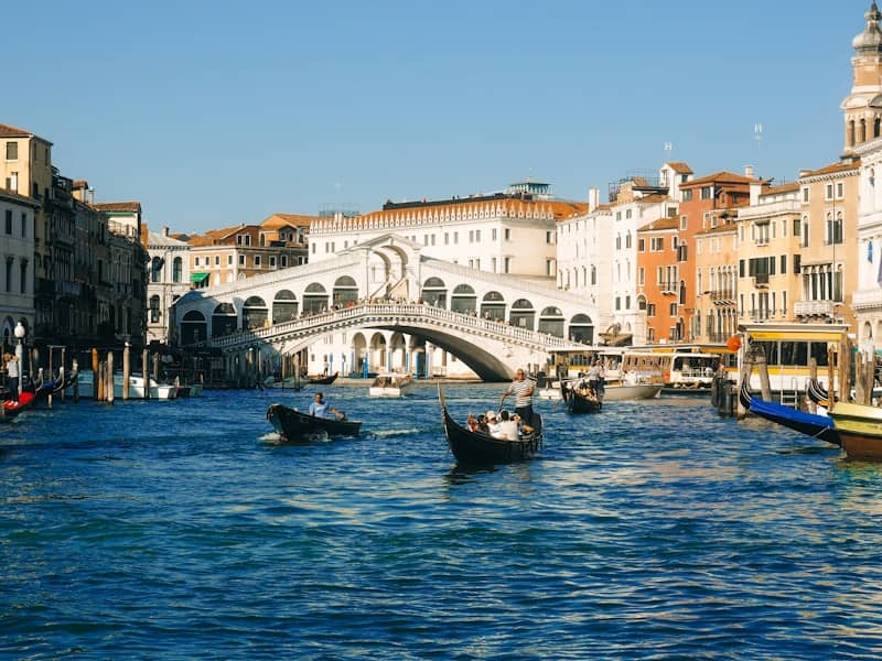 Rialto bridge over the grand canal in venice with gondolas