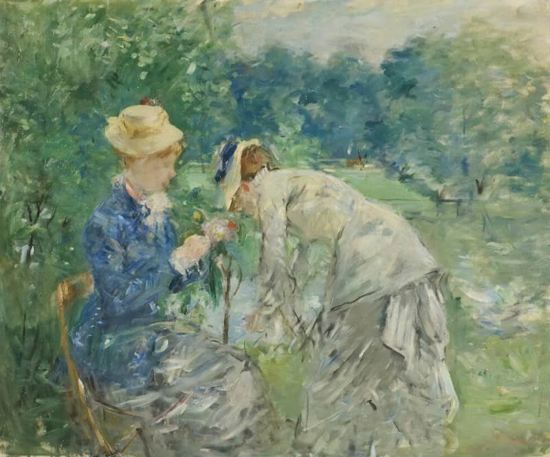 man and woman kissing on green grass field during daytime