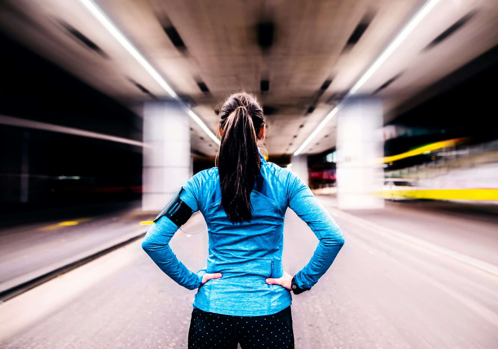 A midlife woman in running gear, waiting to start her life.