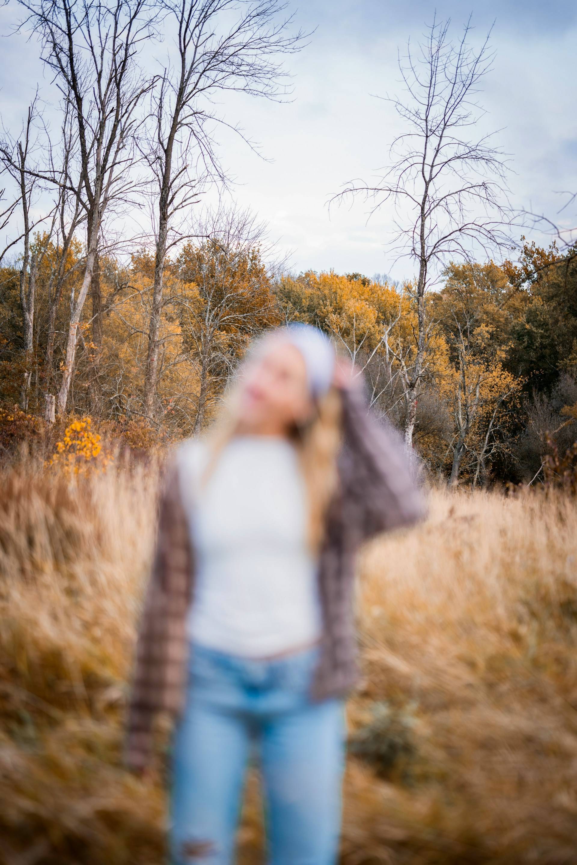 A blurry image of a woman whose fall doesn't feel like she thought it would.