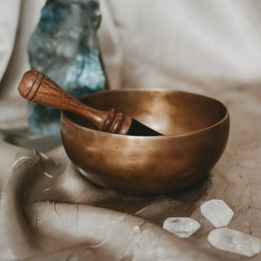 brown wooden bowl on white textile