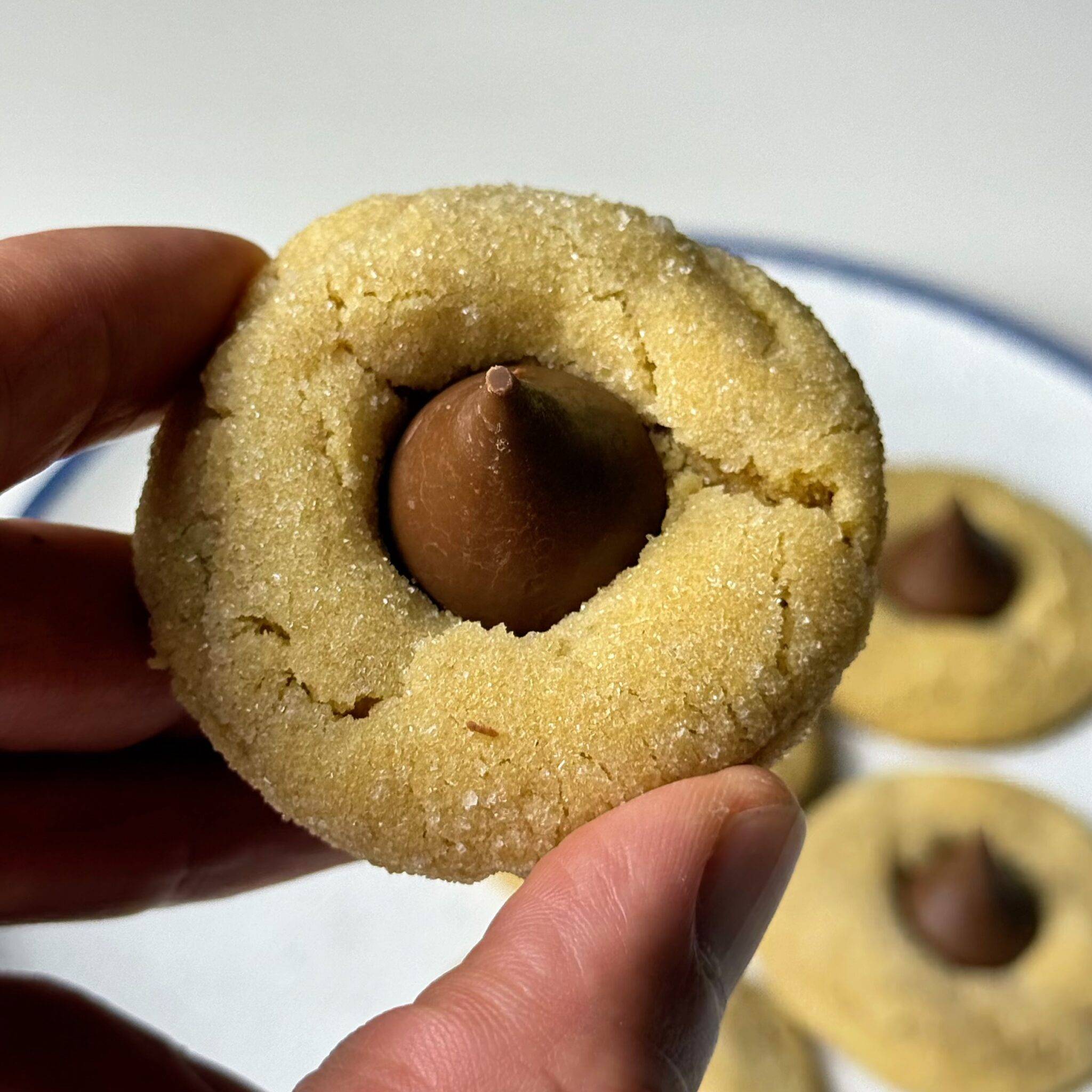 Peanut Butter Blossoms — sugar-coated peanut butter cookies with milk chocolate centers