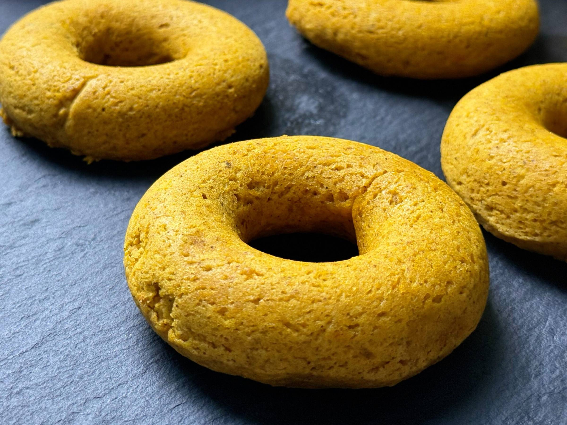 008 donuts 1 — Baked pumpkin spice donuts on a dark slate board