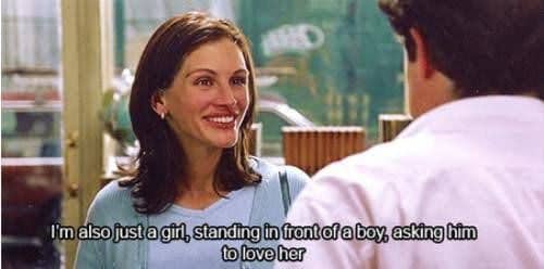 Iconic romantic scene from the movie 'Notting Hill' with Julia Roberts saying the famous line, 'I'm also just a girl, standing in front of a boy, asking him to love her,' while standing opposite Hugh Grant.