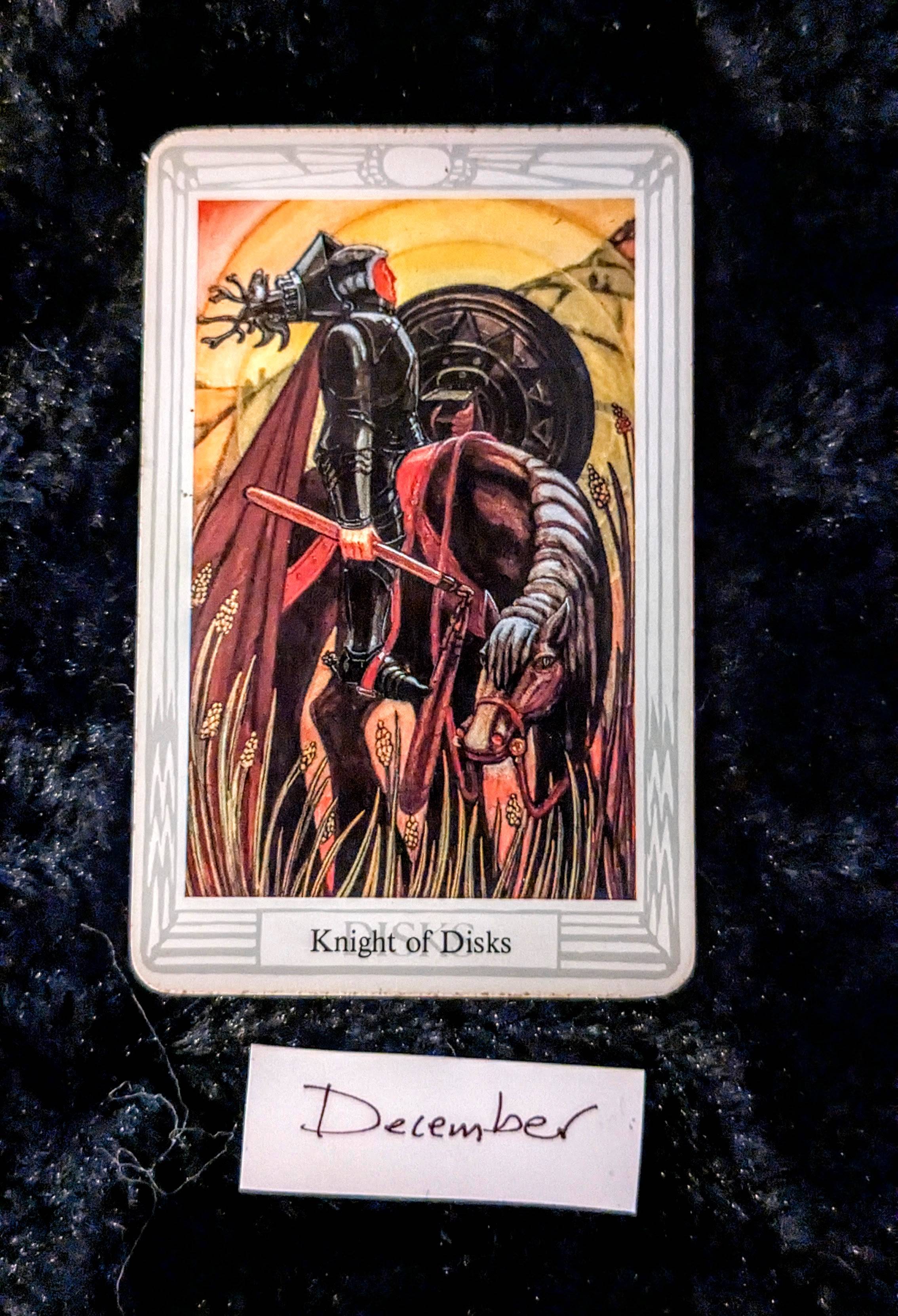 the knight of disks tarot card over a black faux fur background