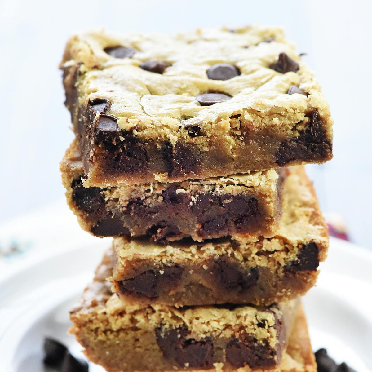 Classic blondies recipe piled on plate.