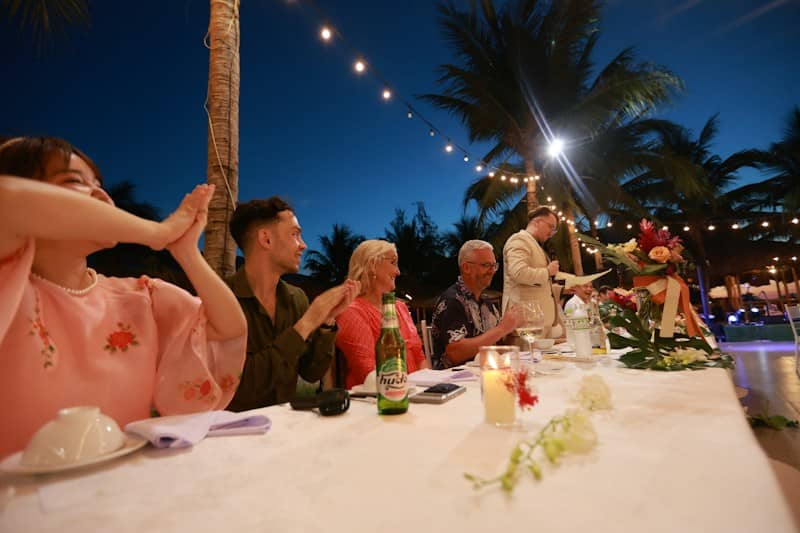 People celebrating at an outdoor evening event