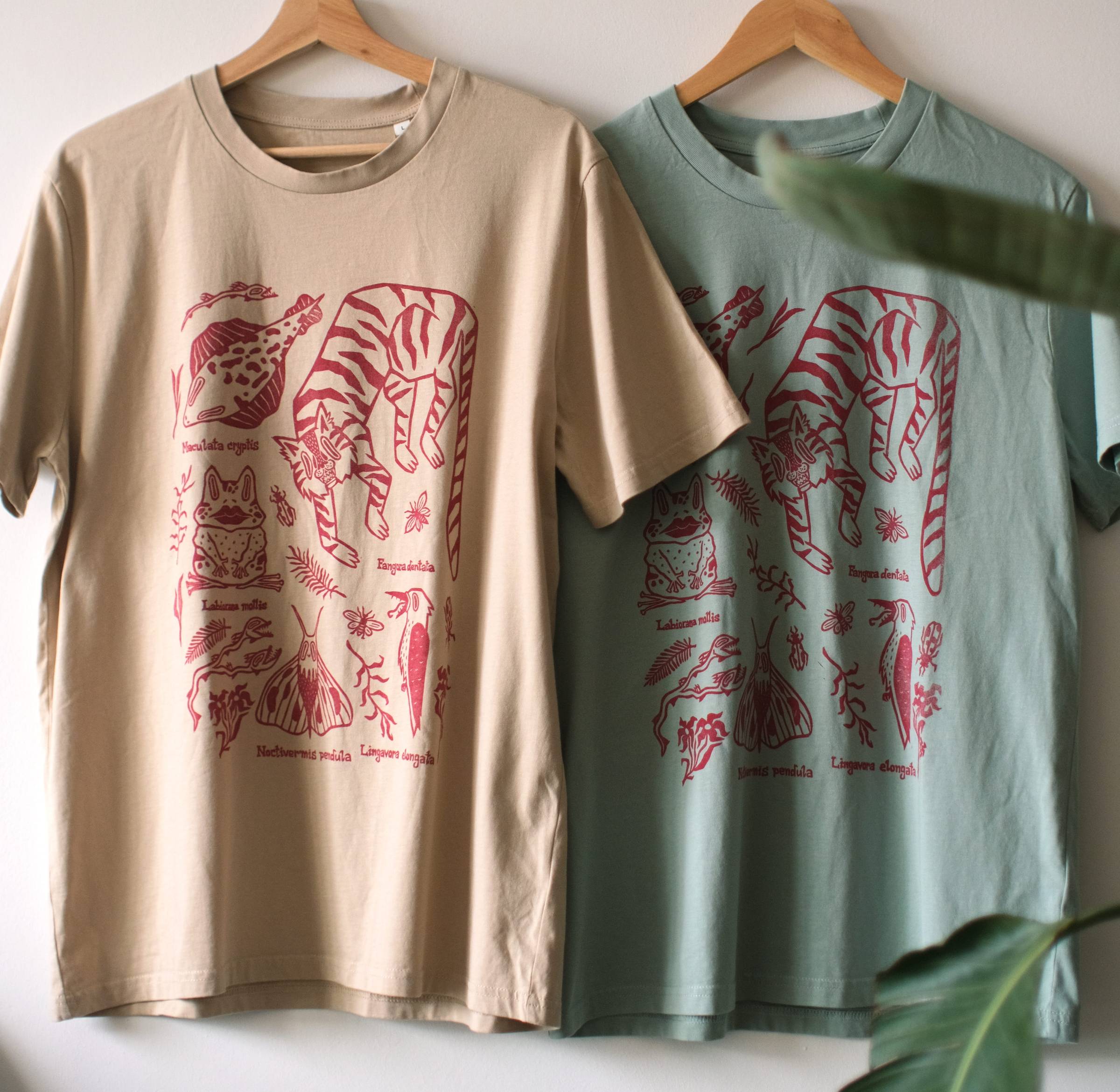 Beige and light blue hand-printed T-shirts with red linocut designs, shown side by side.