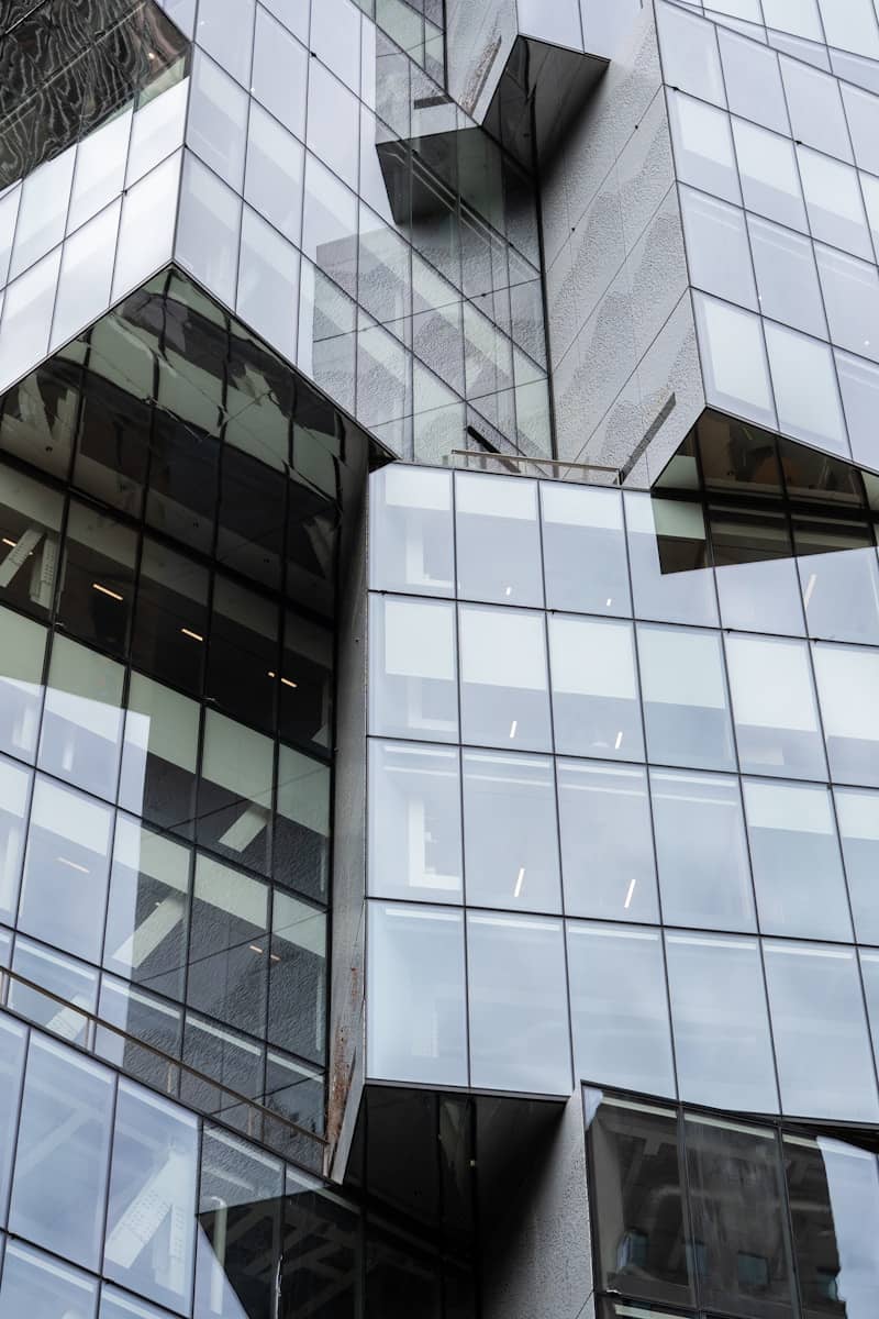 Glass and concrete architecture with geometric shapes.