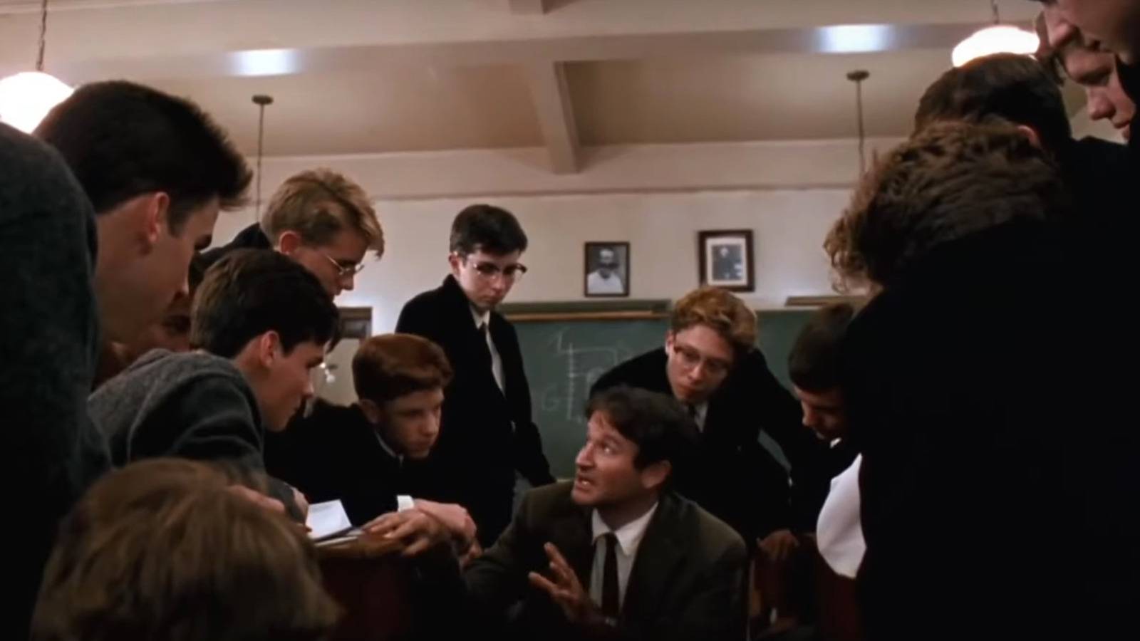 Robin Williams surrounded by his students in The Dead Poets Society