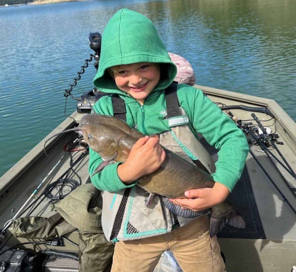 A picture of Max Diamond, winner of heaviest catfish in last year's fish derby, holding his winning fish.