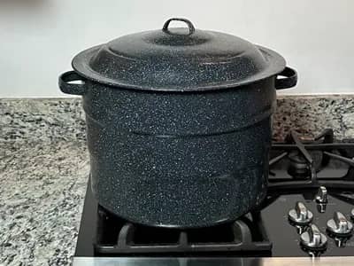 Water Bath Canner Sitting on a stove burner.