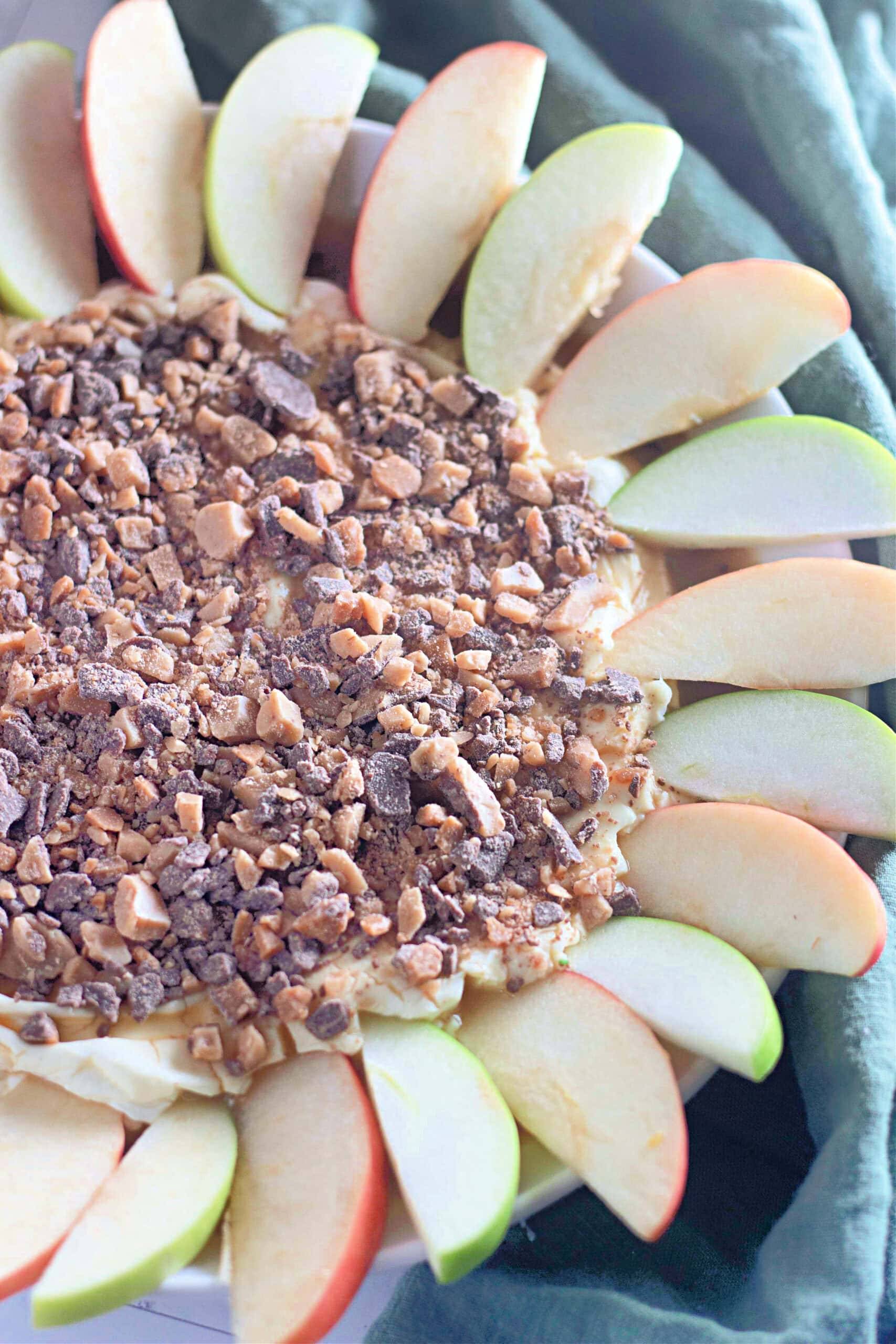 Apple slices circle a toffee-topped dip.