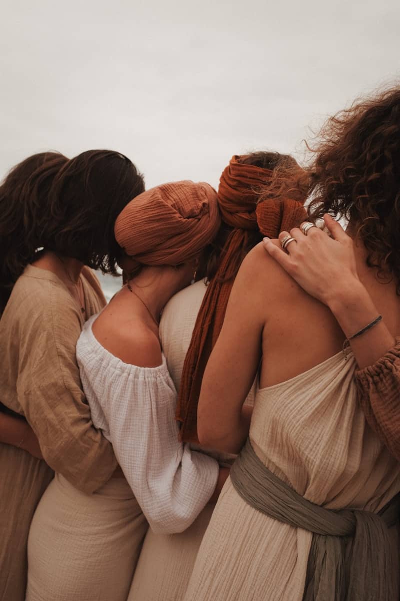 A group of women standing next to each other