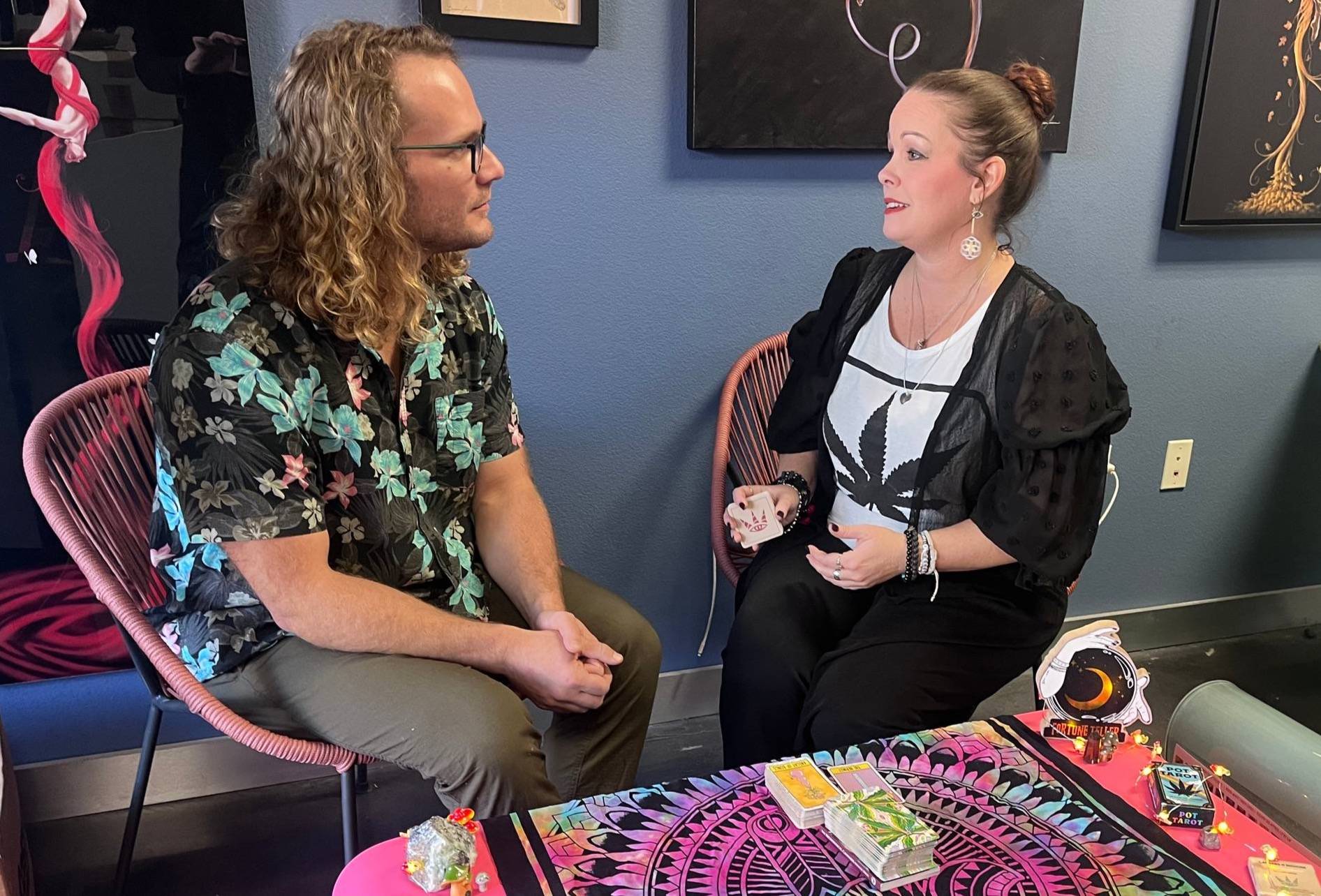 John Shute, CEO of PufCreativ gets a tarot reading from Abi Wright, The Cannastrologer