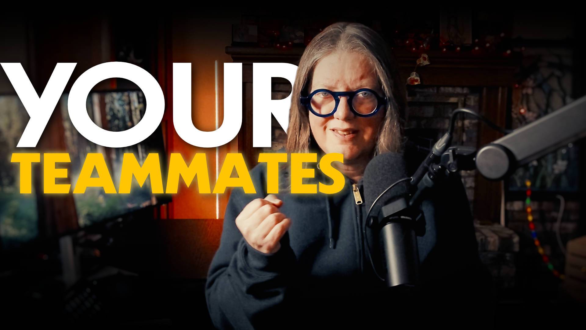 Jen behind a microphone in her office with the text "your teammates"