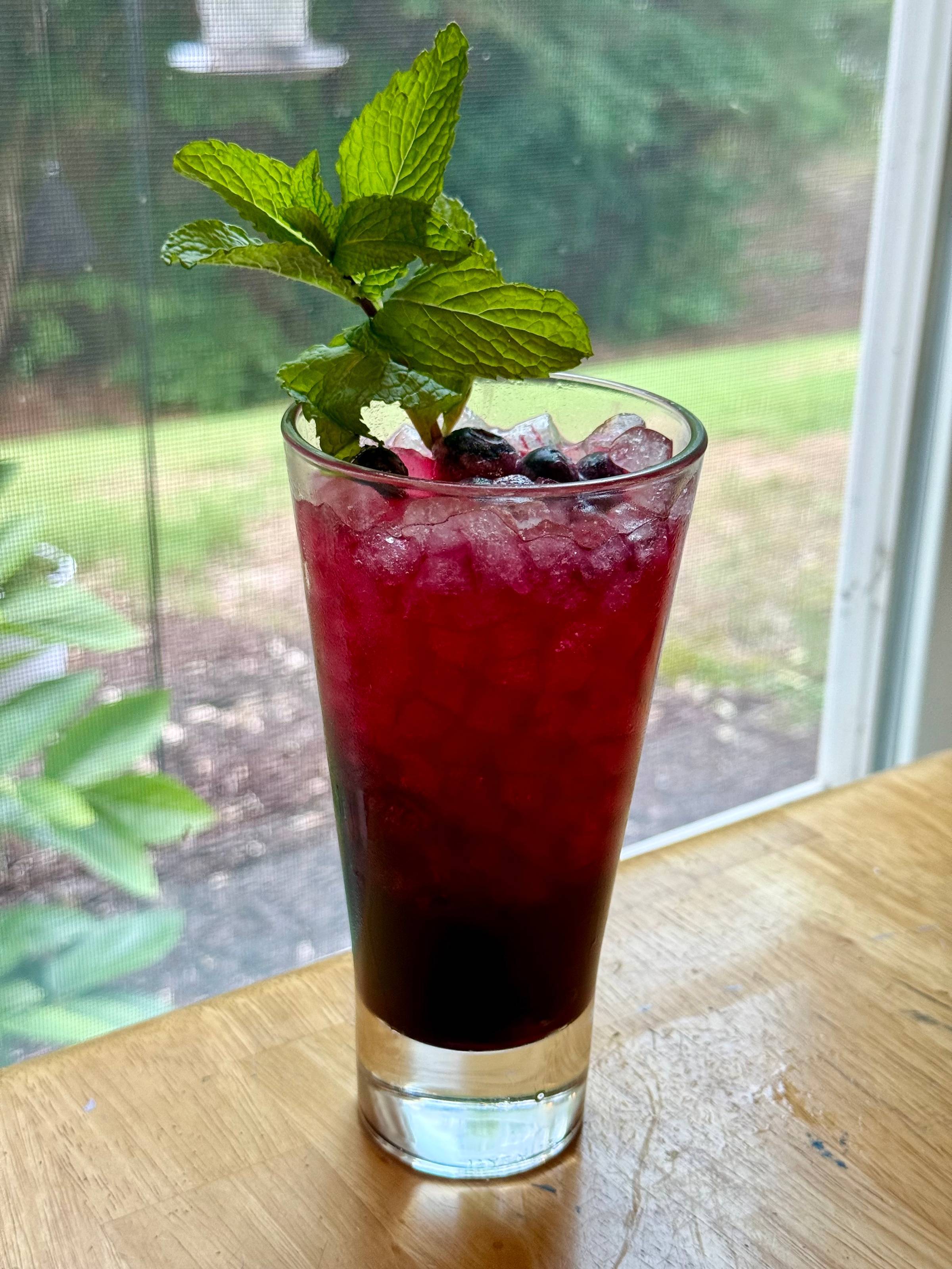 Healing Blueberry Mojito Mocktail drink recipe in a tall glass with ice