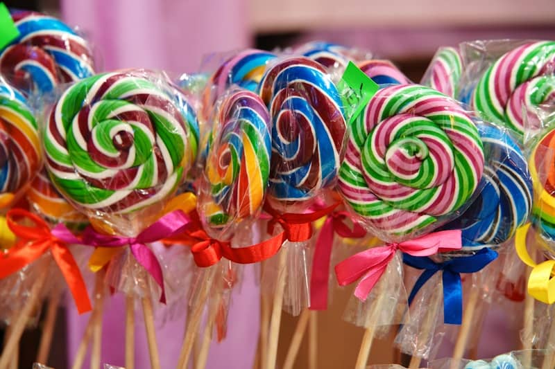 Colorful swirl lollipops tied with ribbons
