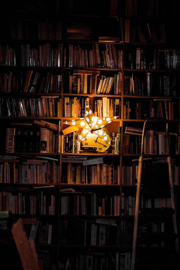 photography of bookshelf and star LED light decor