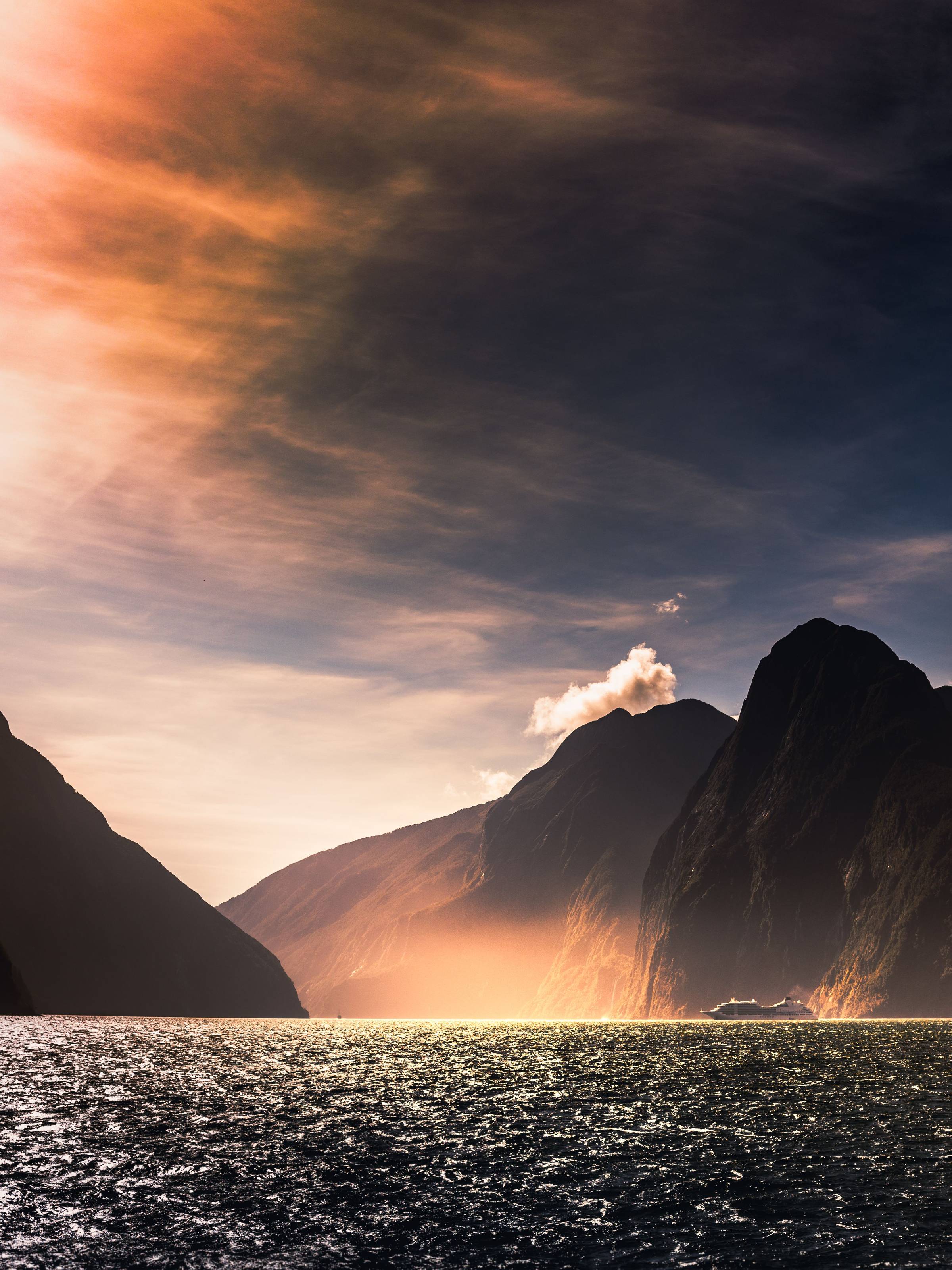 A small cruise ship in a sound in New Zealand.