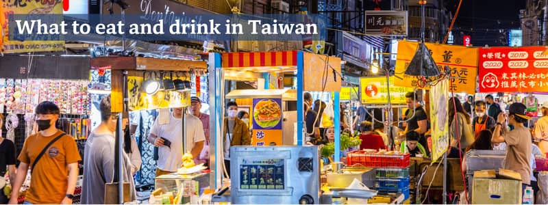 Stalls selling street food at a night market in Taipei, Taiwan