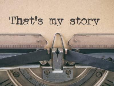 close up of paper in a typewriter; typed words: That's my story