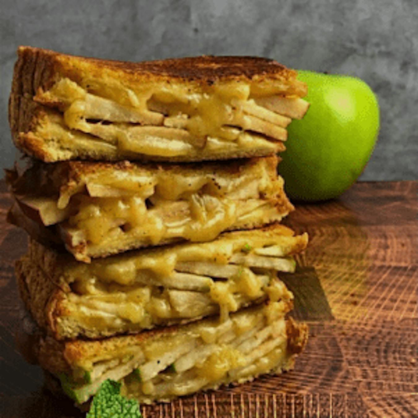 stack of apple and gouda grilled cheese showing the cross-section