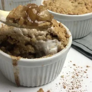 cinnamon apple crumbles with spoonful of apple filling