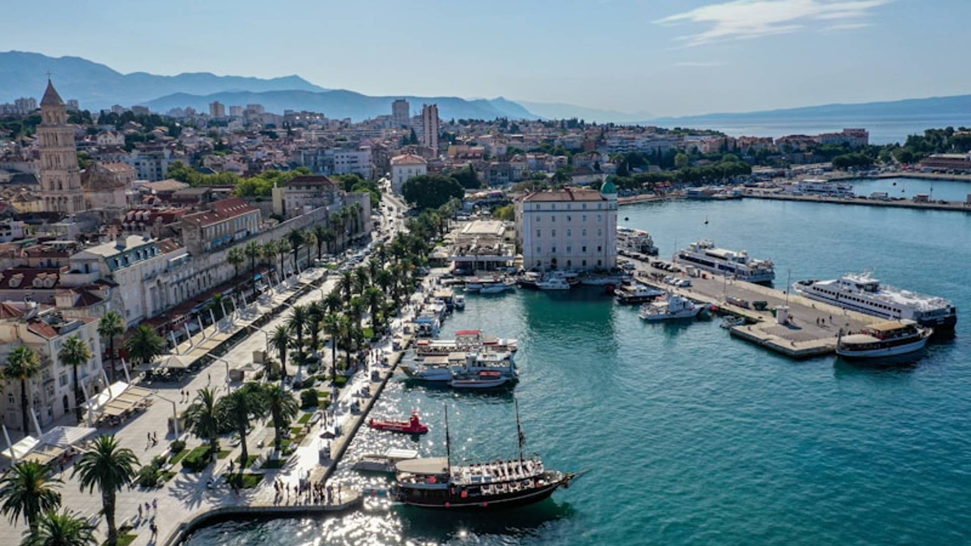 red and white boat on body of water during daytime