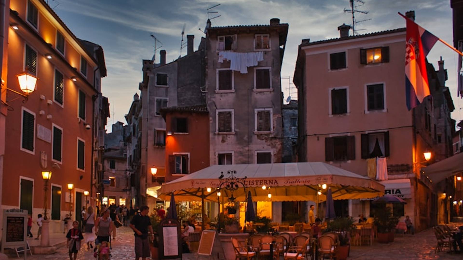 people walking on street near brown concrete building during daytime