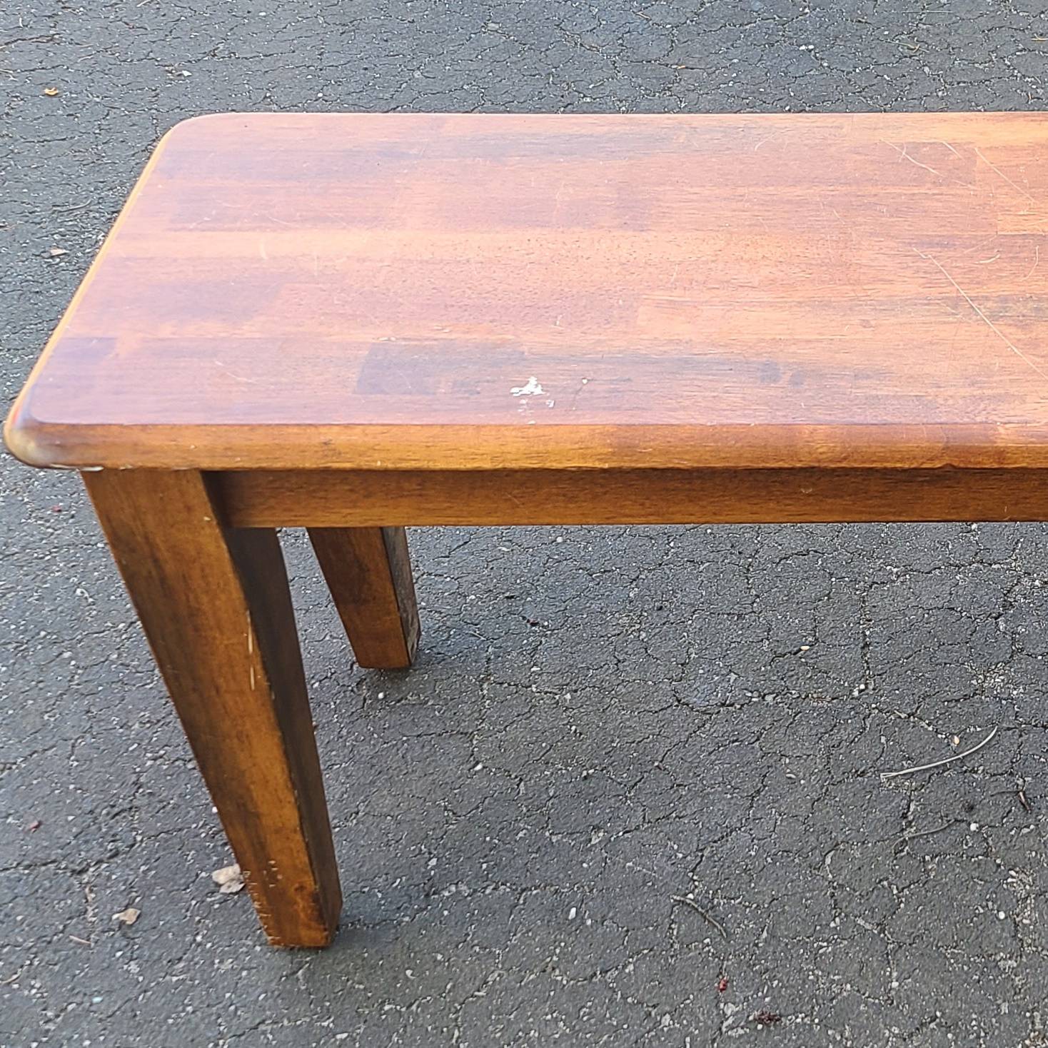closeup of a wooden bench seat needing a little TLC