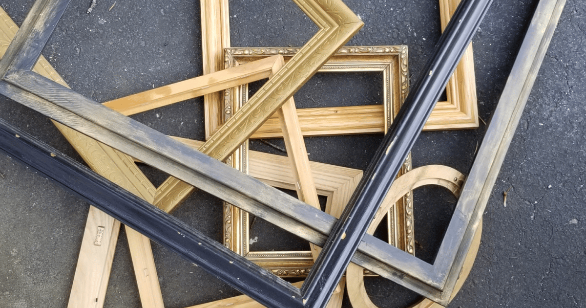 a pile of random picture frames