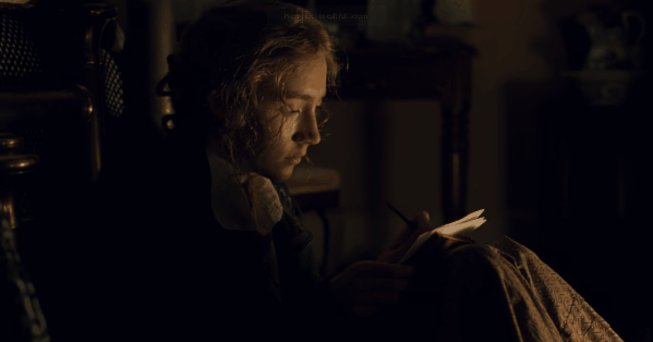 Jo March scribbling away in her notebook