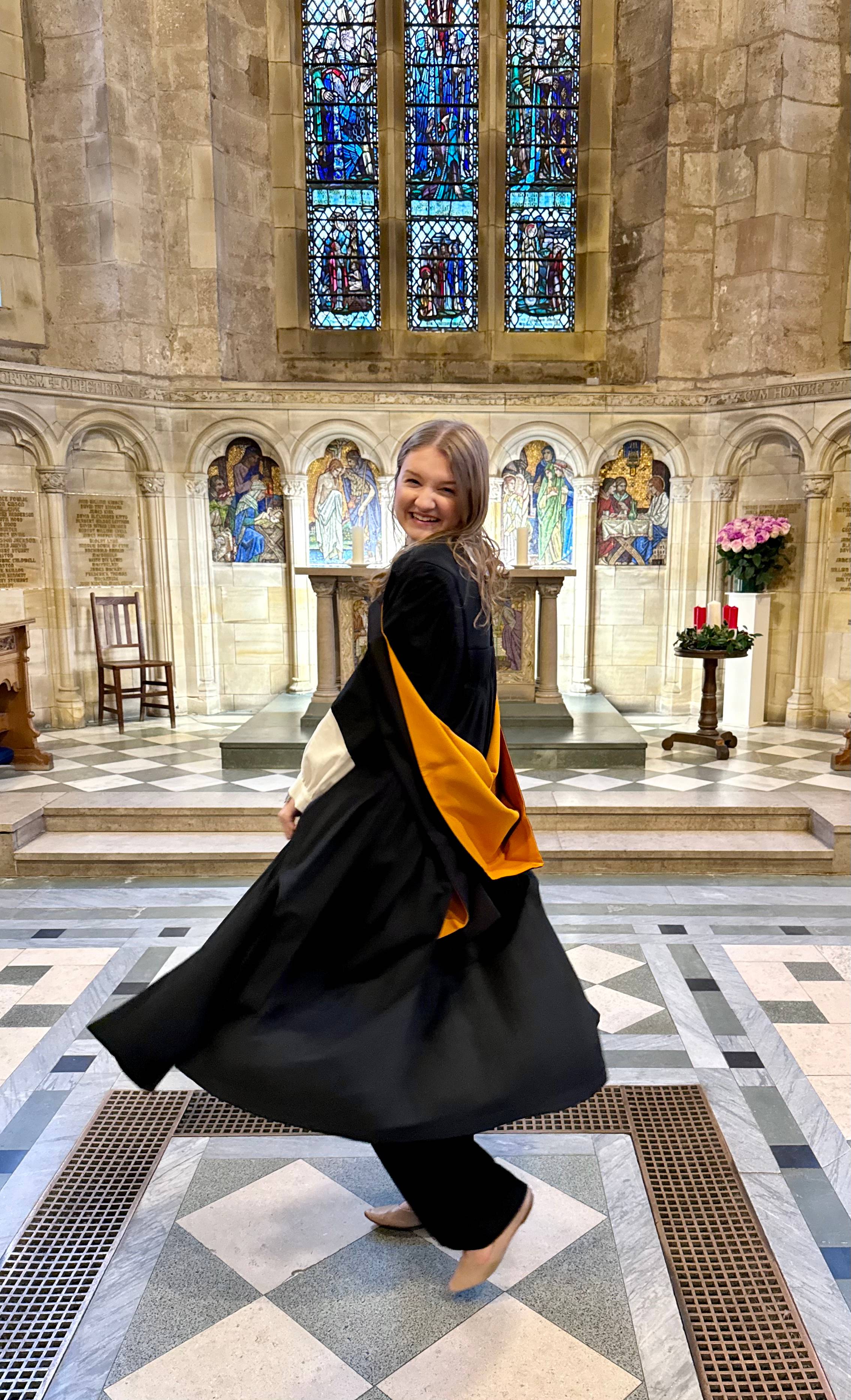Audrey in graduation gown at UStA