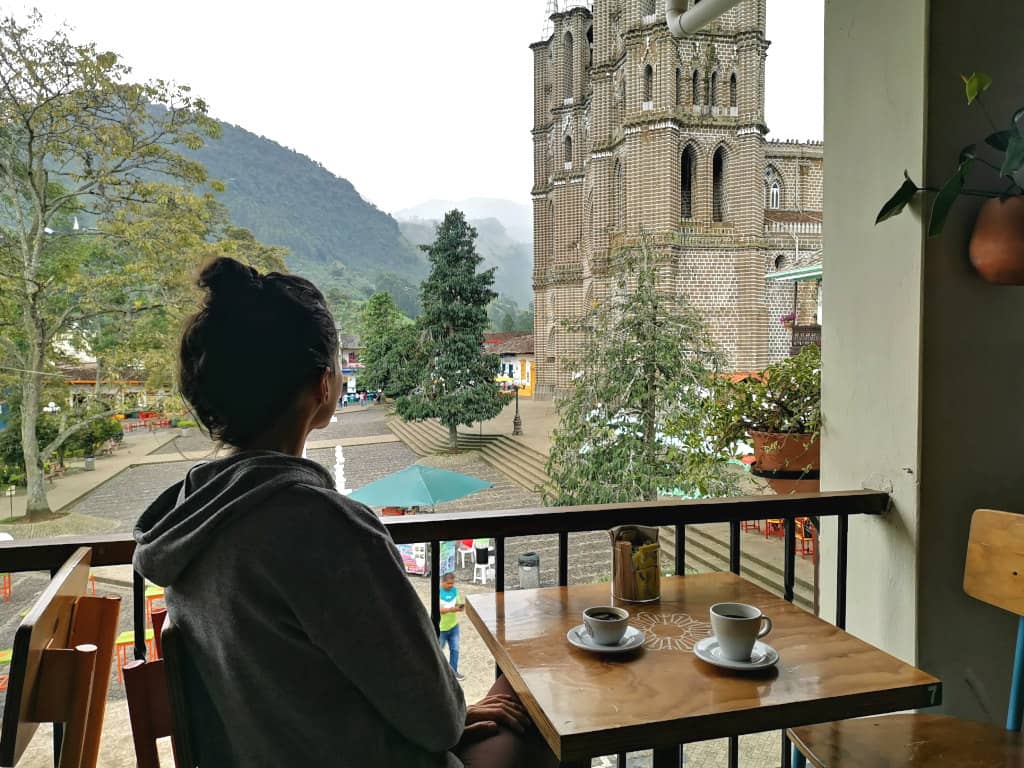 Katharina overlooking the town square in Jardin, Colombia from a local coffee shop.