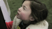 Meme gif. A young girl turns and looks at us with a creepy smirk on her face.